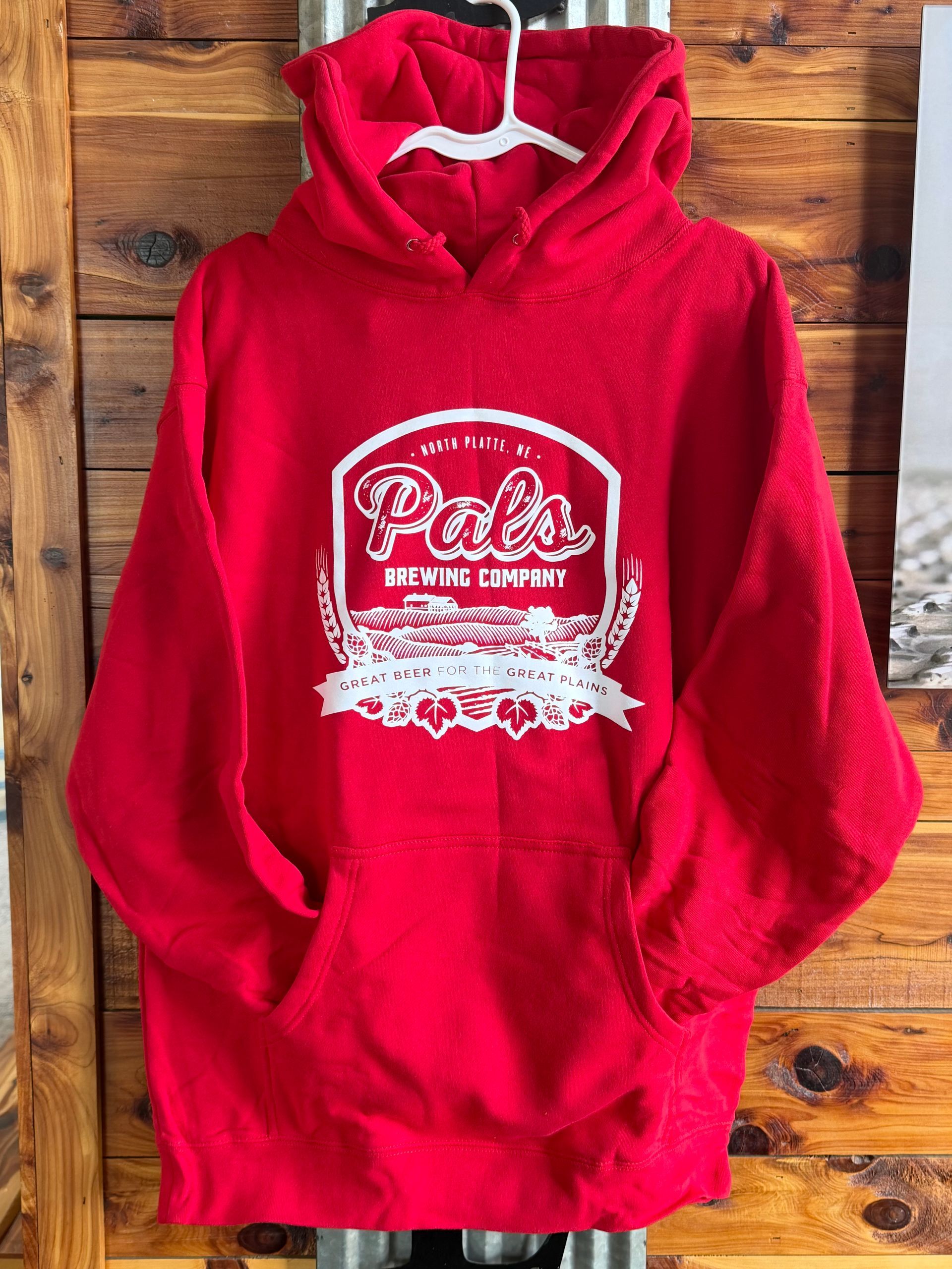 Red hoodie with a white logo for