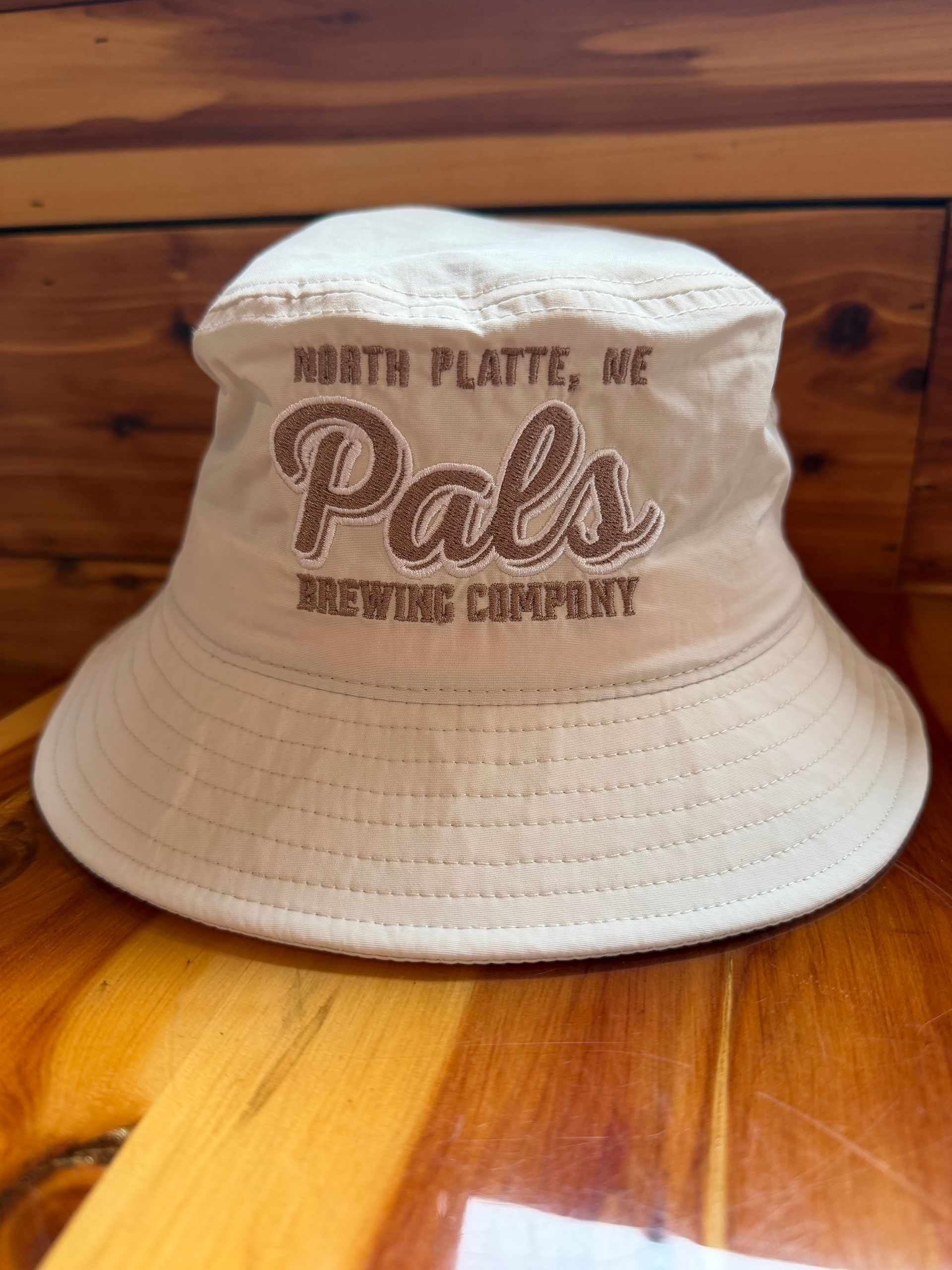 Cream-colored bucket hat with 