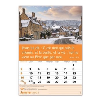 A calendar with a picture of a snowy village and a bible verse.