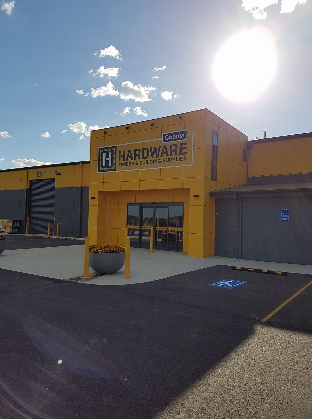 A shelf full of different types of metal pipes