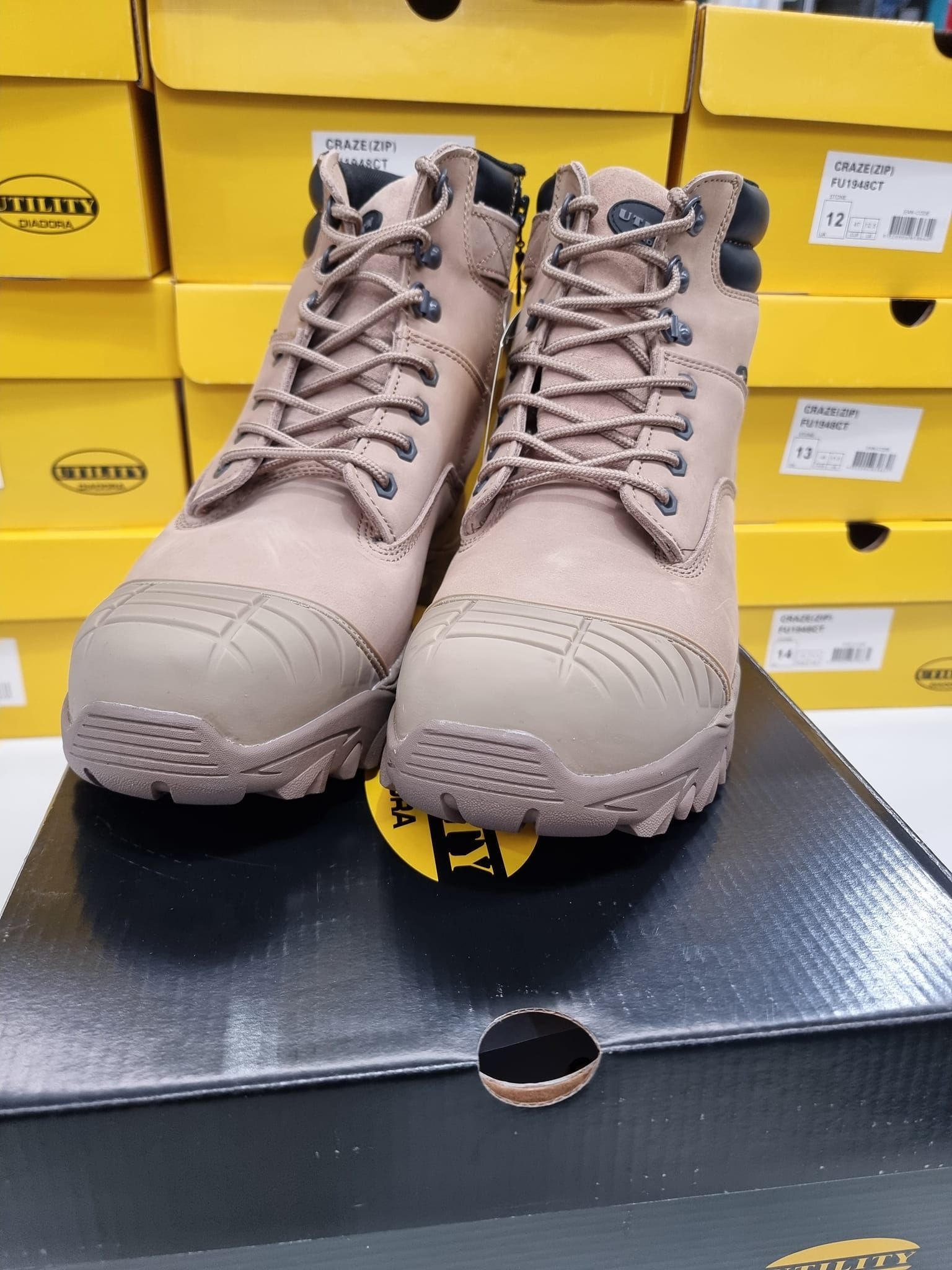 A pair of boots are sitting on top of a box.