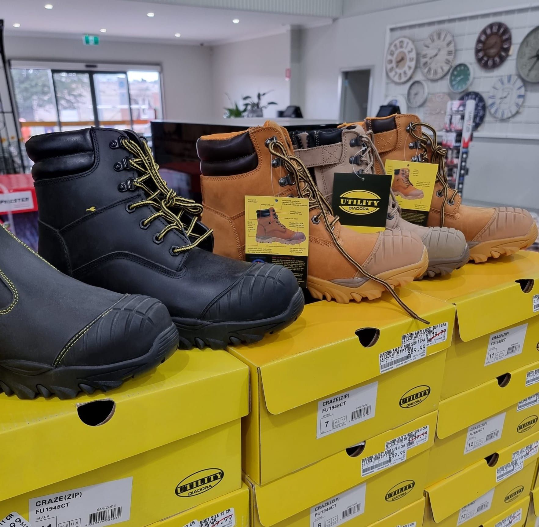 Several pairs of boots are stacked on top of each other