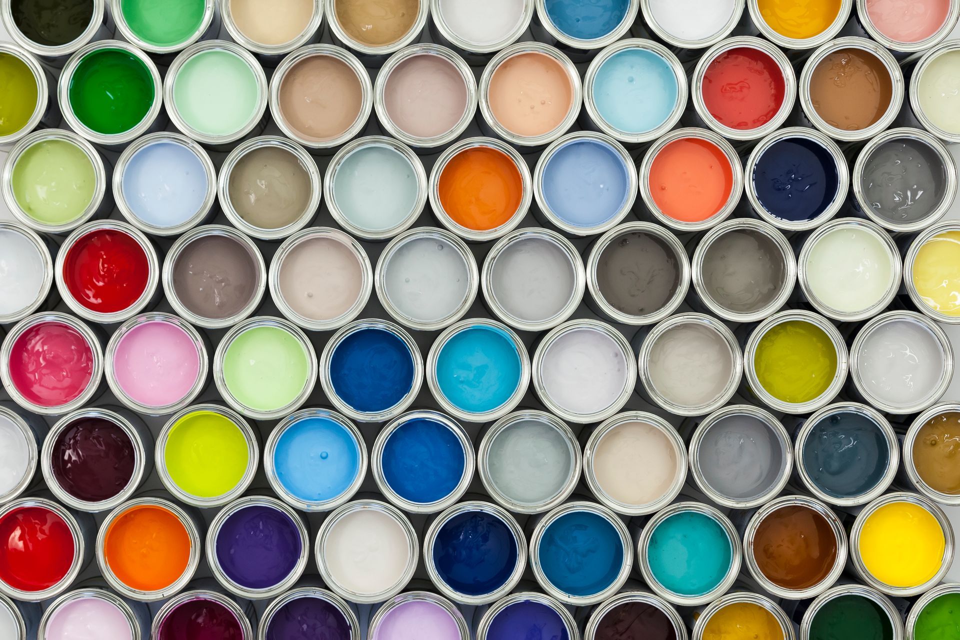 A bunch of paint cans are lined up in a circle
