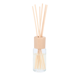A bottle of reed diffuser with wooden sticks in it