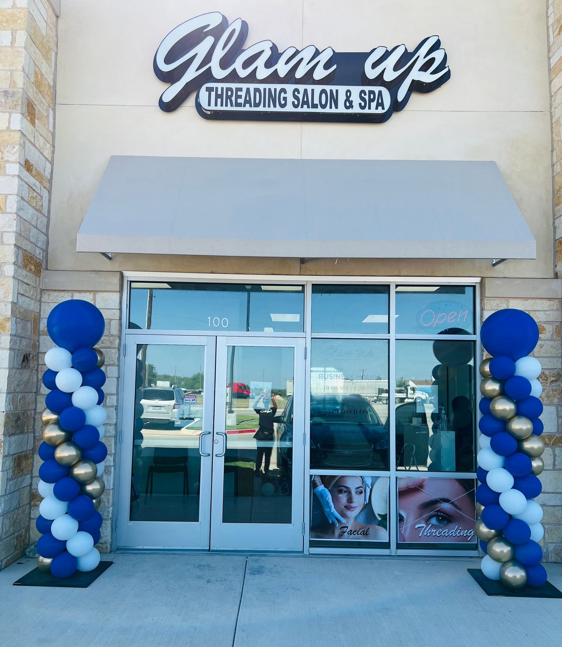 The front of a glam up threading salon and spa
