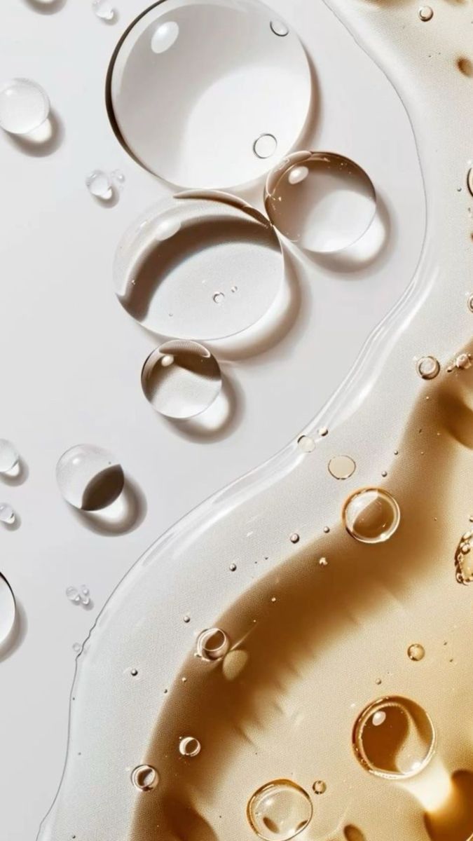 Treatment room with massage table, lamp, and window with flowers.