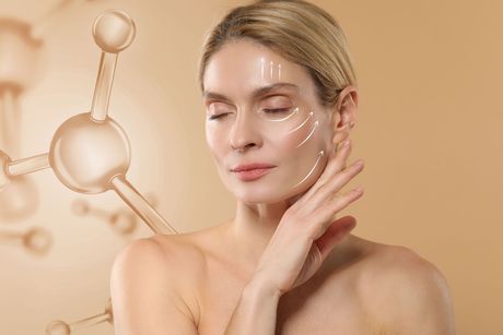 A person with glowing skin poses next to a translucent molecule graphic, with subtle white lines highlighting facial areas.