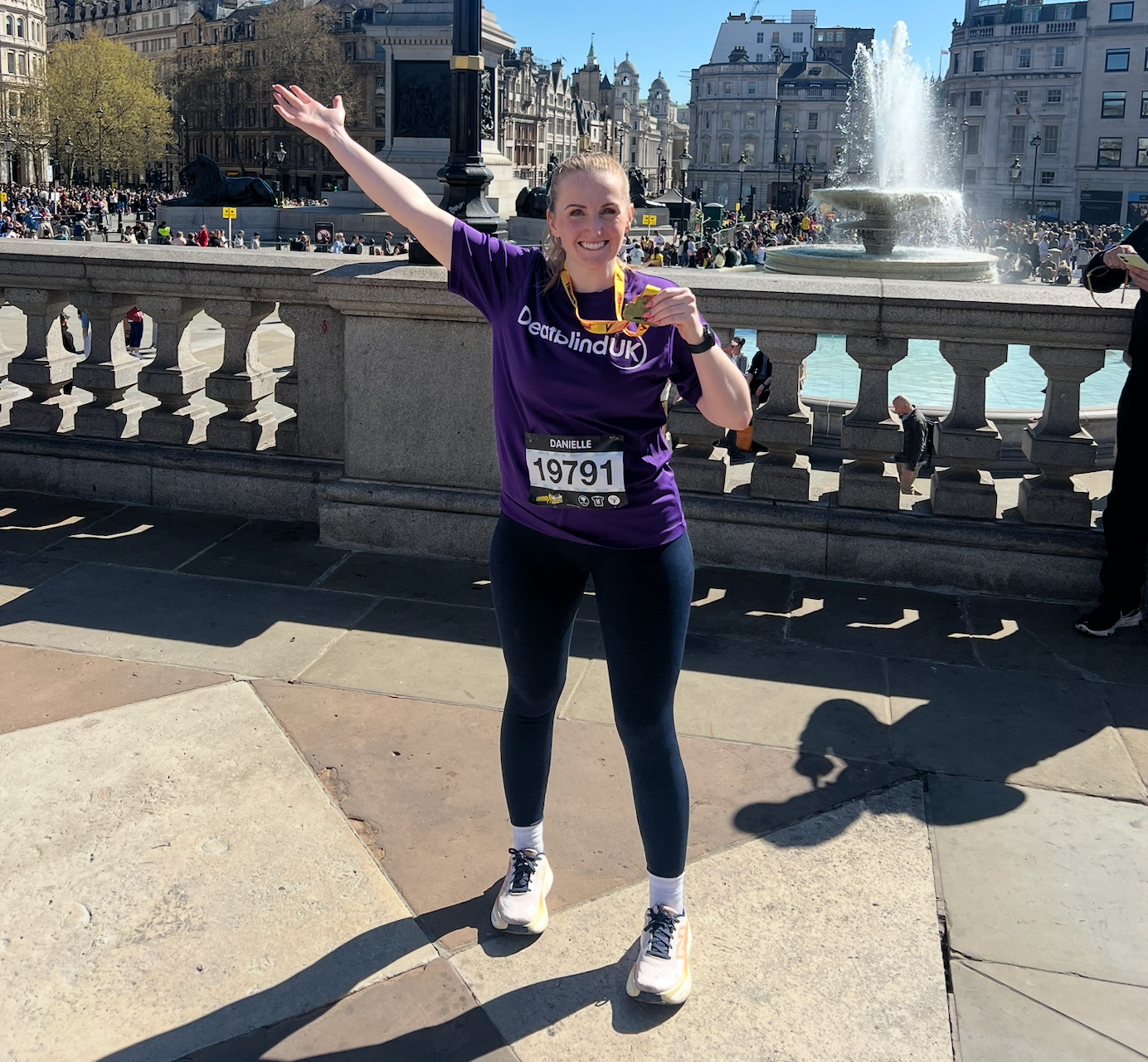 Danielle Darby holding a meal after running a charity half-marathon run