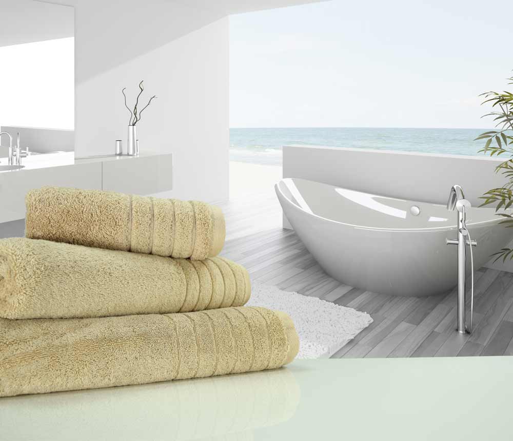 Neatly folded natural linen luxury towels in a bathroom