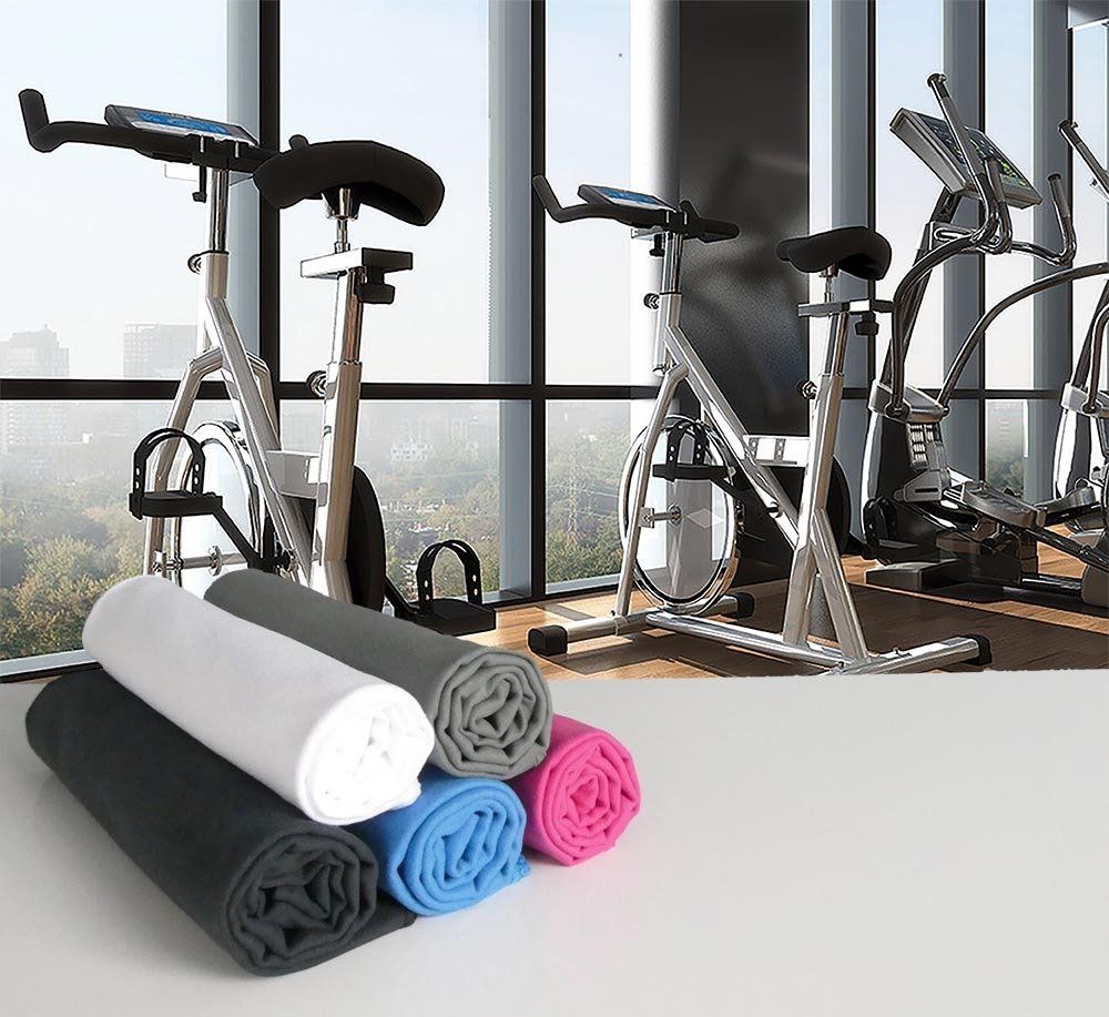 Folded Super-Soft XXL Gym Towels on a table in a gym