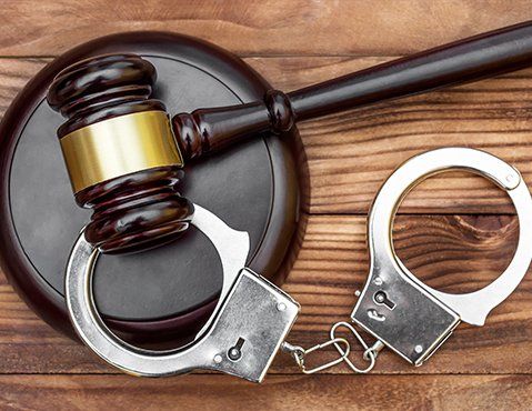 Felony Defense Attorney — Gavel with Stand & Handcuffs in San Antonio, TX