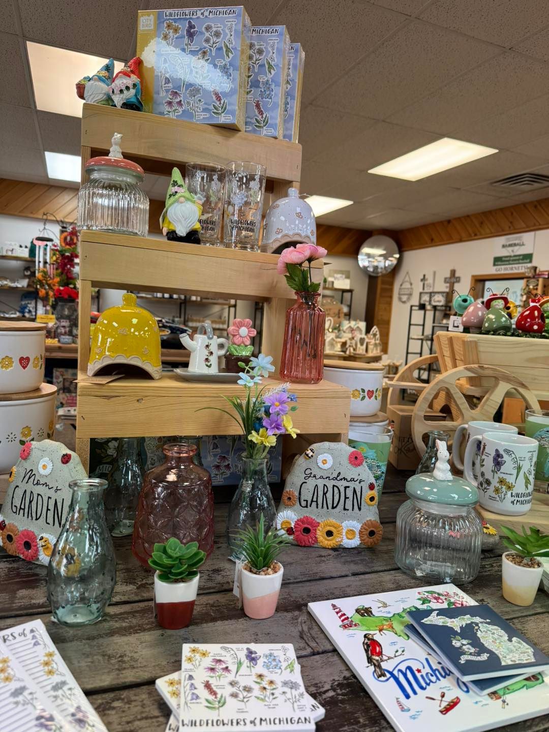 A table in a store filled with lots of vases and jars.
