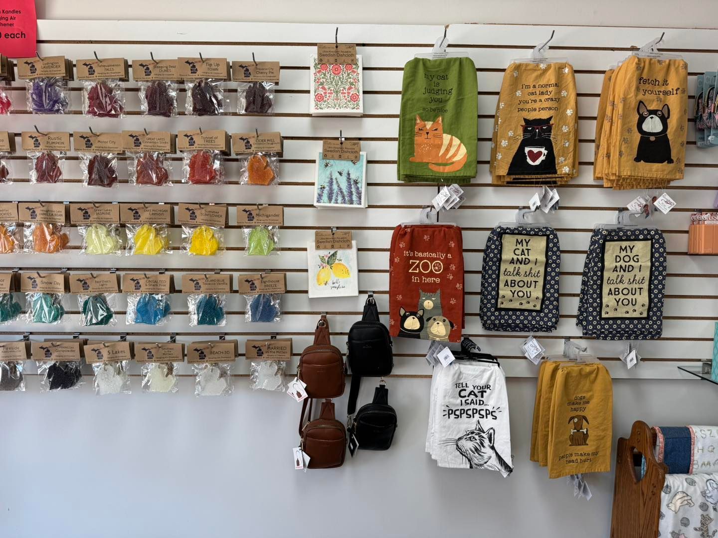 A wall with a bunch of towels hanging on it