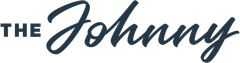Logo reading “The Johnny” in dark blue script and block letters on a white background