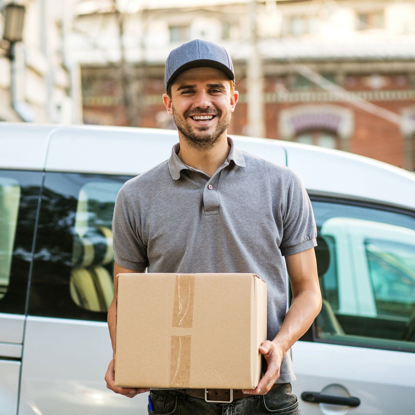 Office Equipment Transport — Delivery Man Holding a Box in Jackson, MS