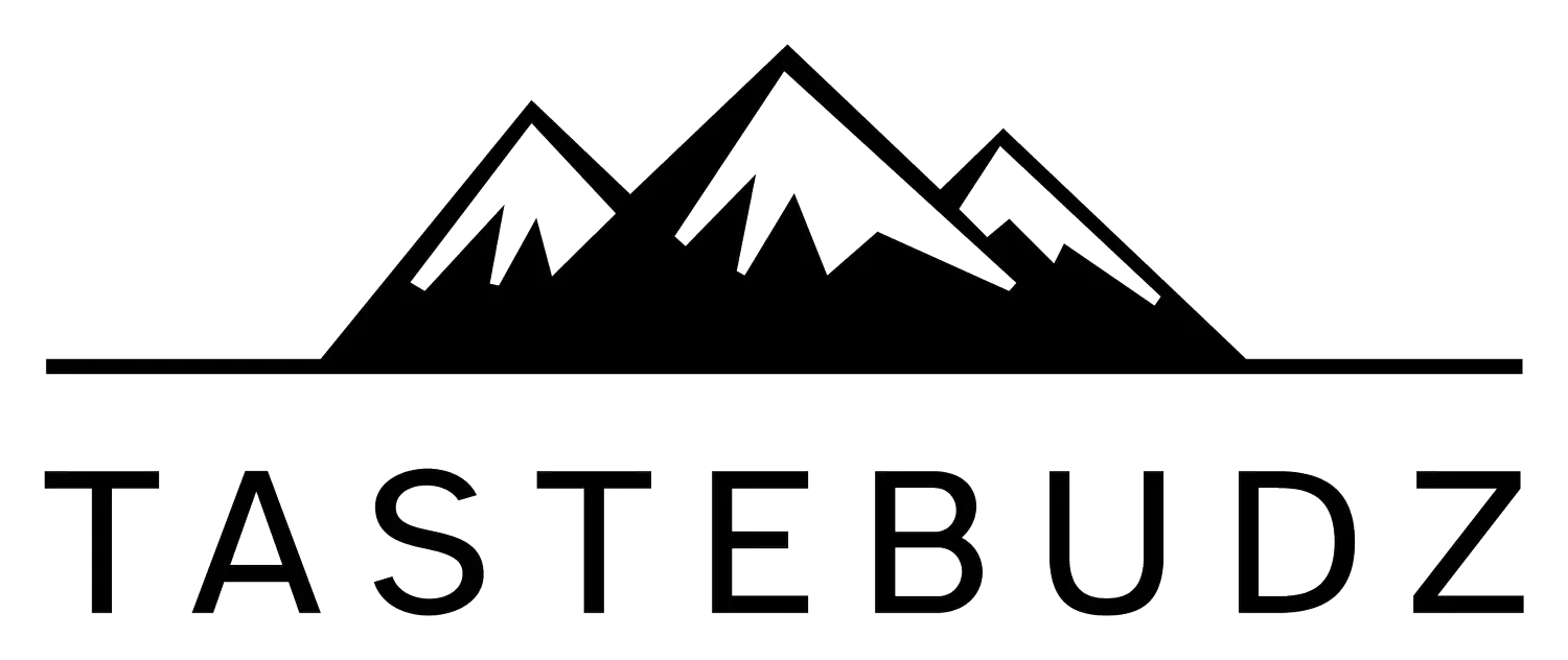 Black and white logo: mountain range above the word TASTEBUDZ.