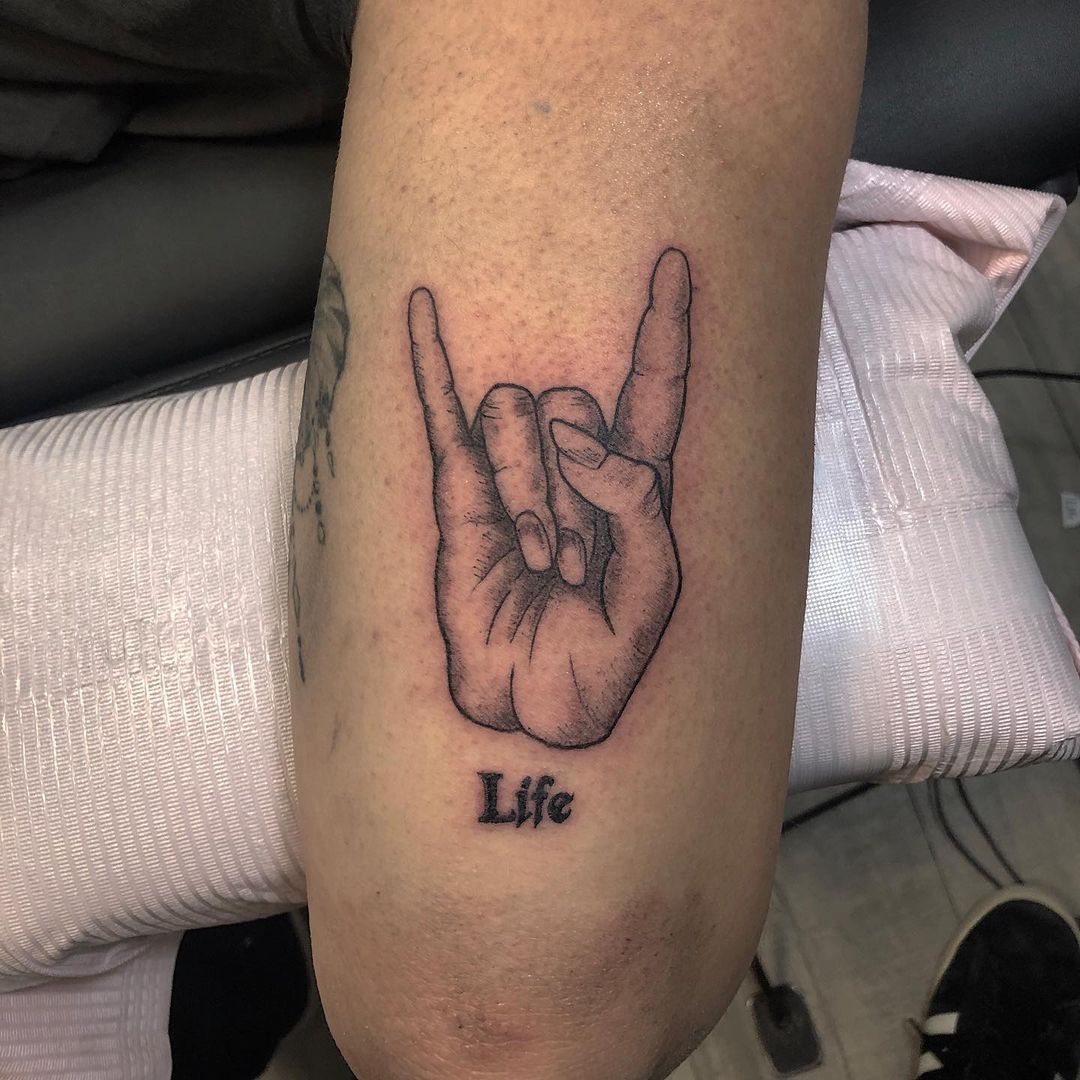 Rock On Tattoo by Tony Honning at Crimson Empire Tattoo in Edmonton Alberta Canada
