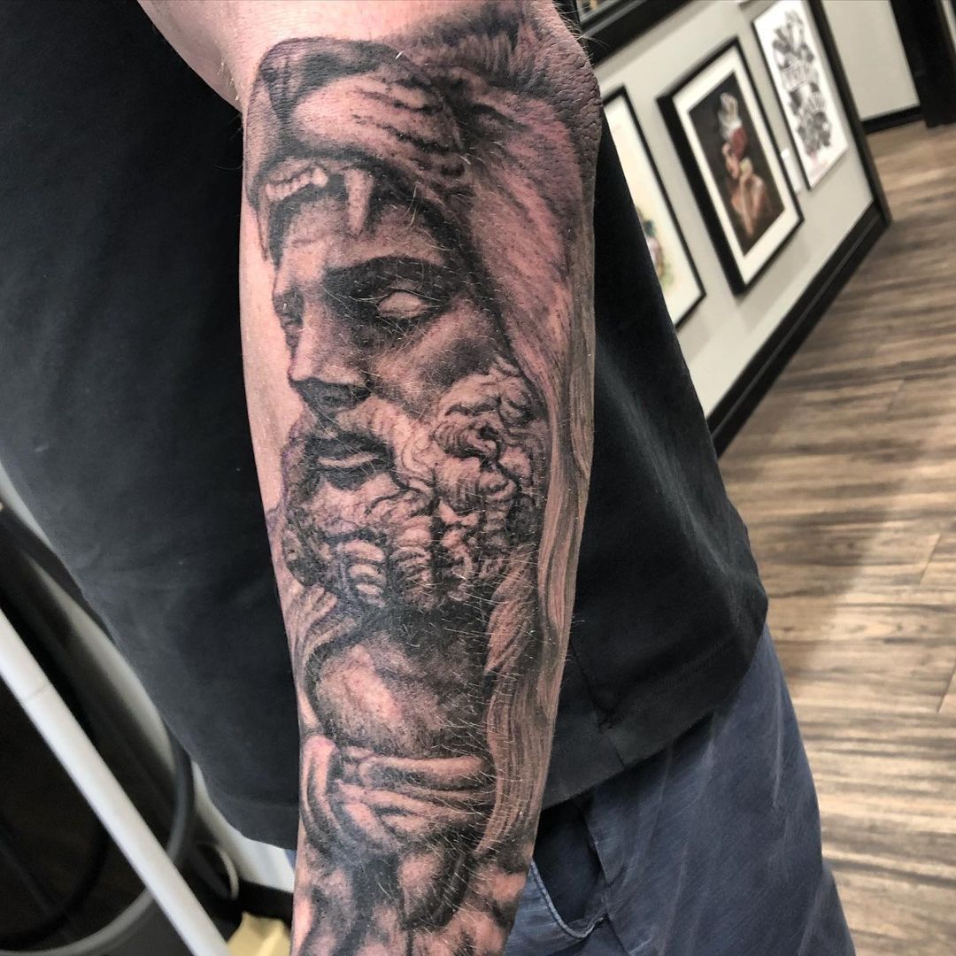 Zeus with Lion Headdress Tattoo by Steve Hayes at Black Gold Tattoo Co in Edmonton Alberta Canada