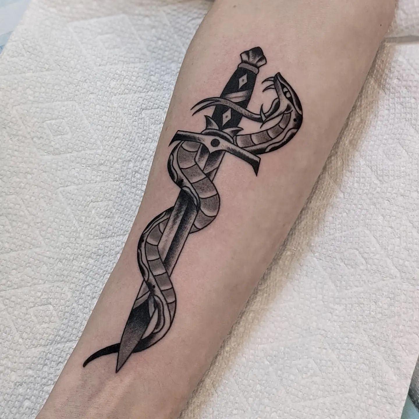 Snake and Dagger Tattoo by Chris Benson at Silver Ghost Tattoo in Edmonton Alberta Canada