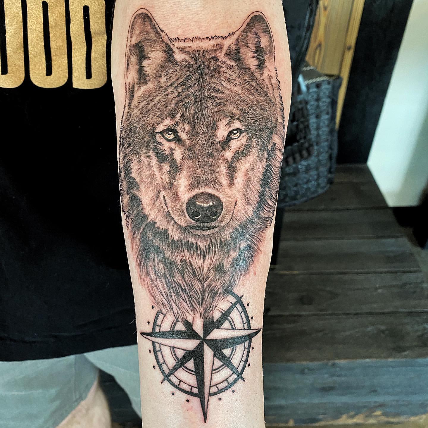 Wolf and Compass Tattoo by Chad Lavers at Crimson Empire Tattoo in Edmonton Alberta Canada