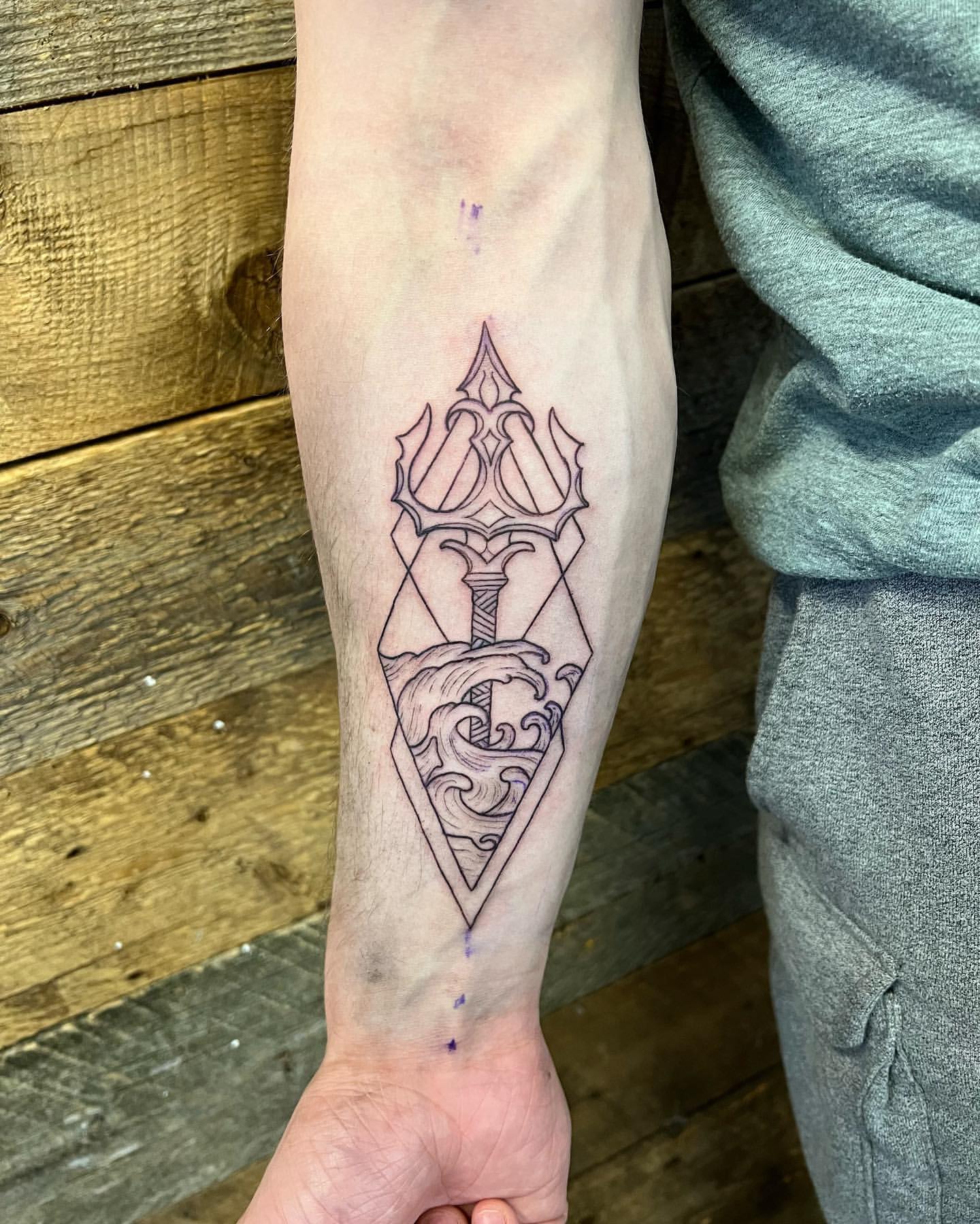 Trident and Wave Tattoo by Vinny Nguyen at Crimson Empire Tattoo in Edmonton Alberta Canada