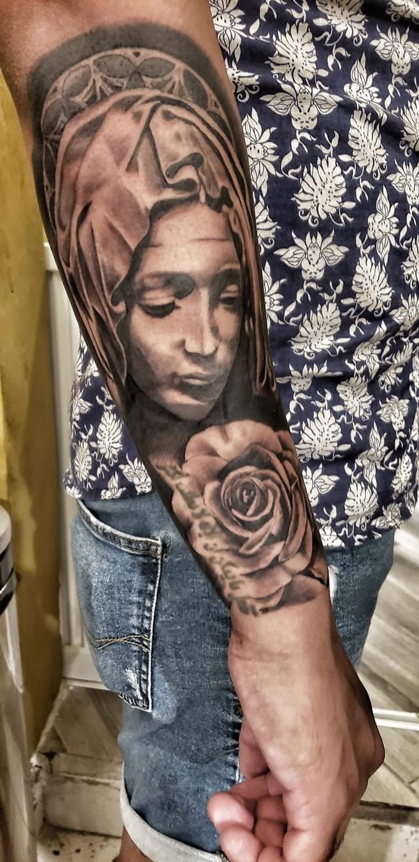 Virgin Mary and Rose Tattoo by Sly at Silver Ghost Tattoo in Edmonton Alberta Canada