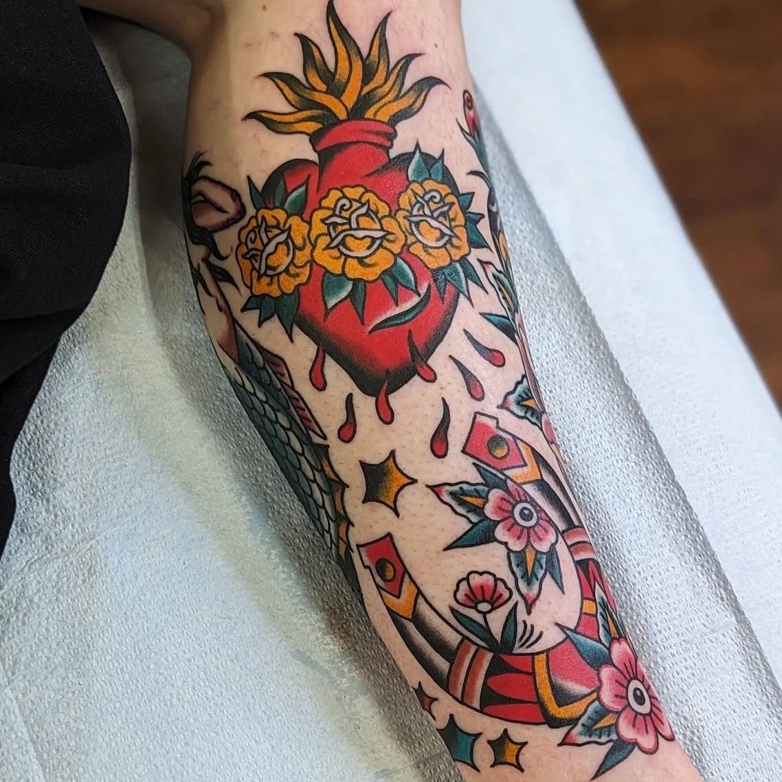Sacred Heart and Horseshoe Tattoo by Chris Benson at Silver Ghost Tattoo in Edmonton Alberta Canada