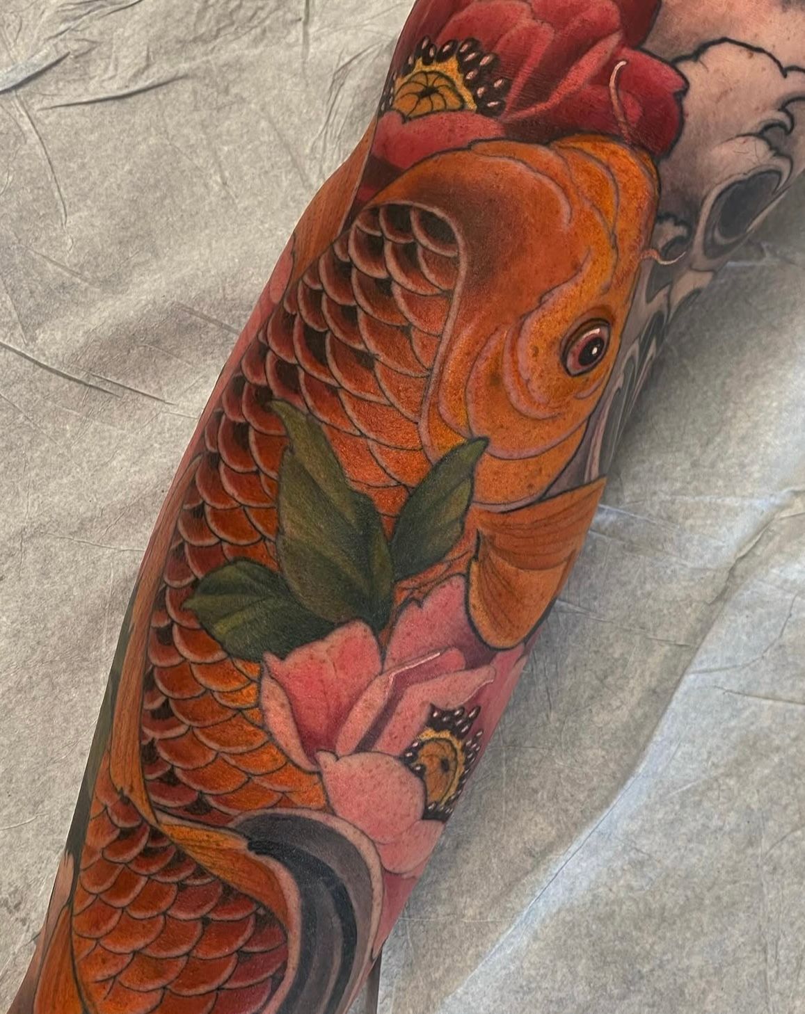 Koi and Floral Tattoo by Sasha Day at Crimson Empire Tattoo in Edmonton Alberta Canada