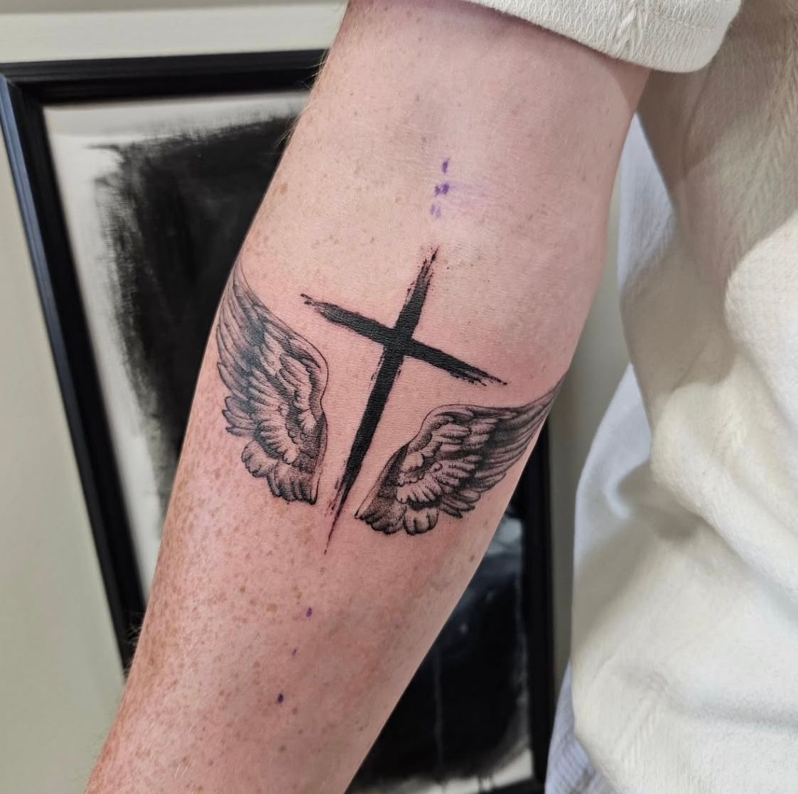 Cross and Wings Tattoo by Ian Wang at Black Gold Tattoo Co in Edmonton Alberta Canada
