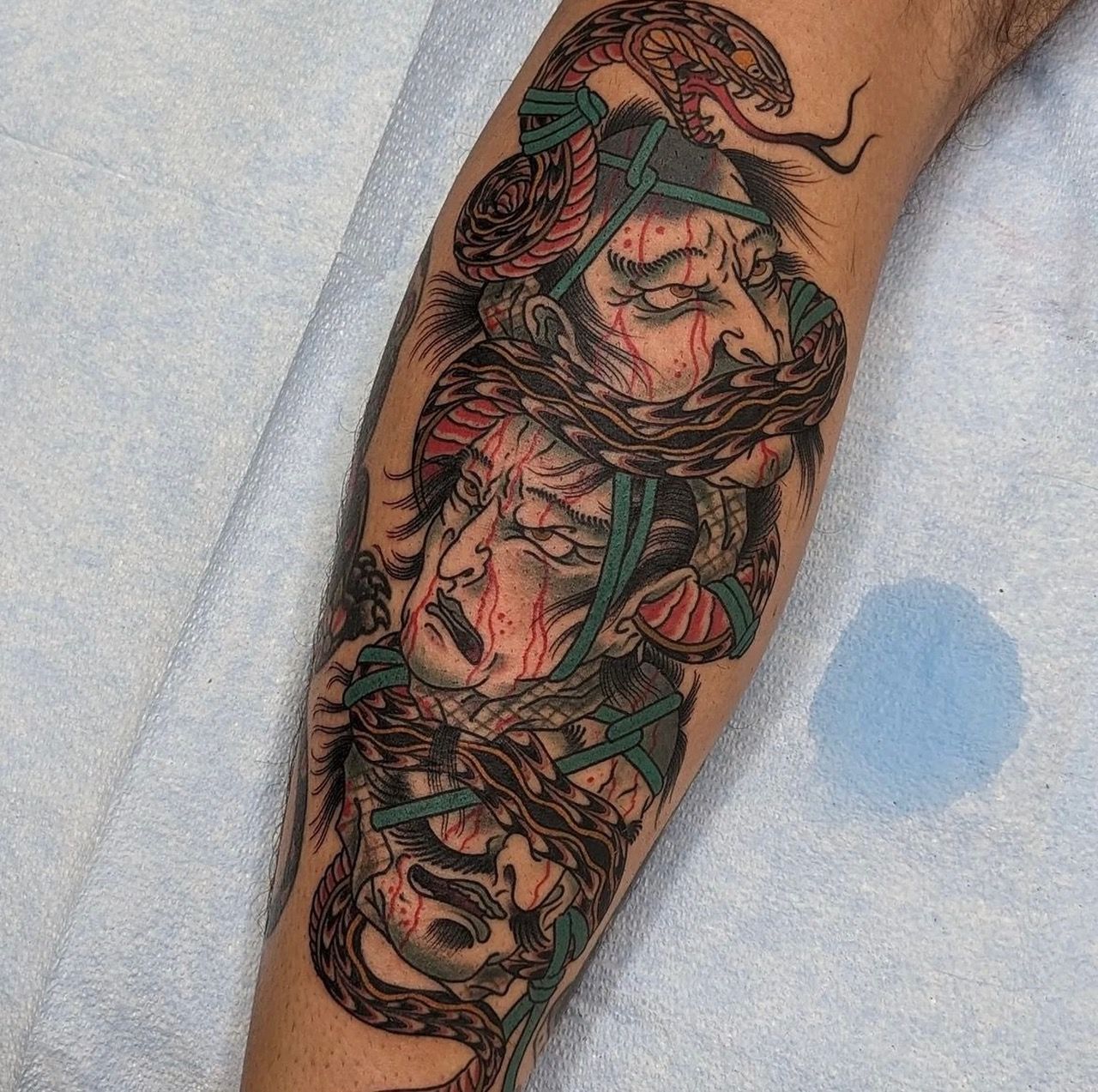 Snake and Severed Heads Irezumi Tattoo by Chris Benson at Silver Ghost Tattoo in Edmonton Alberta Canada