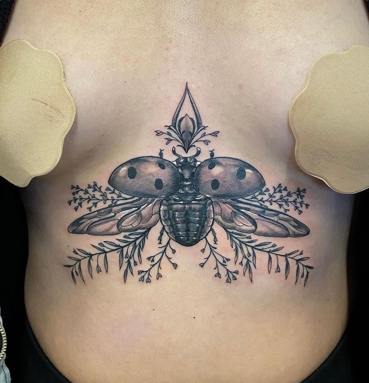 Ladybug Tattoo by Dale Moostoos at Crimson Empire Tattoo in Edmonton Alberta Canada