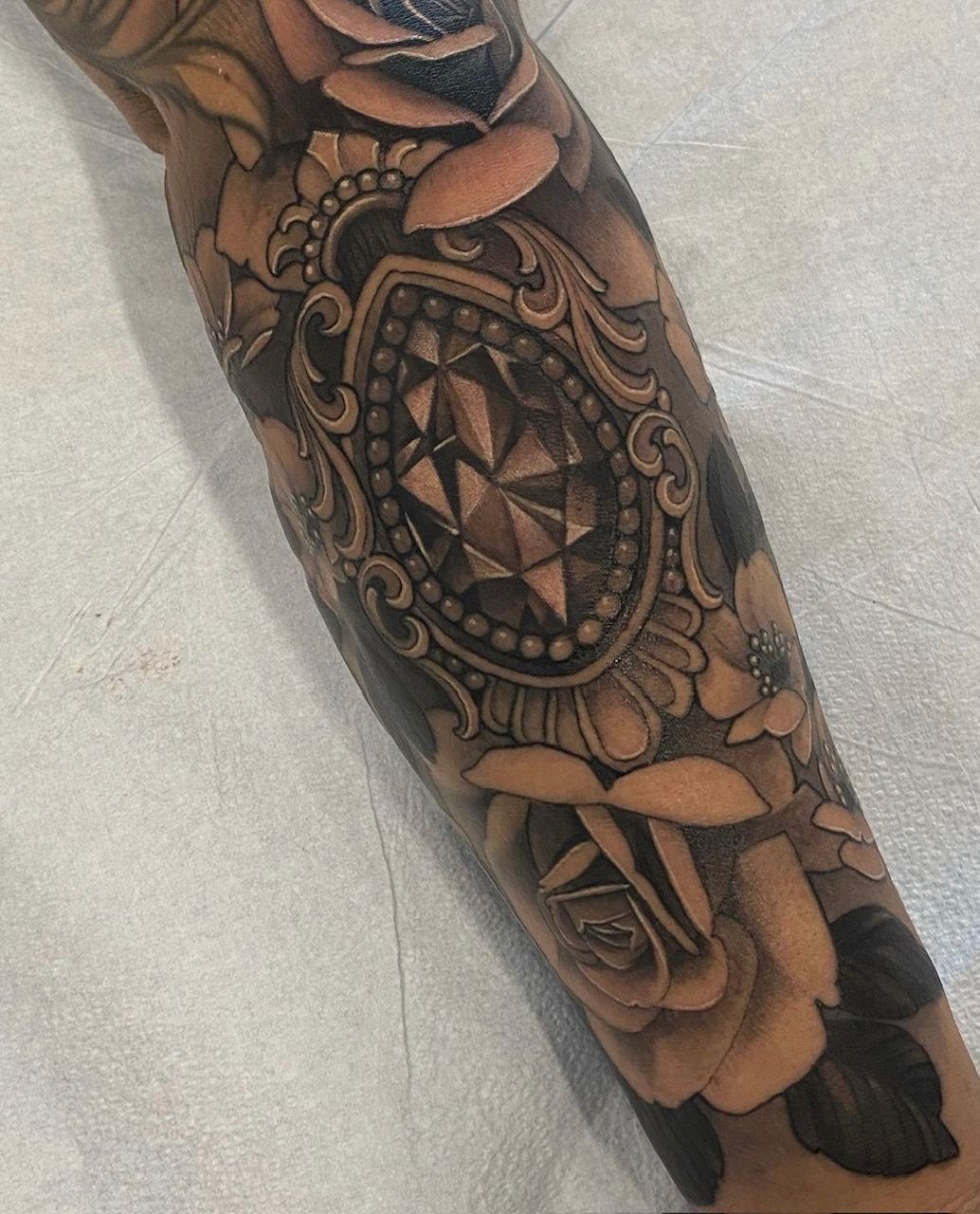 Jewel and Floral Tattoo by Sasha Day at Crimson Empire Tattoo in Edmonton Alberta Canada