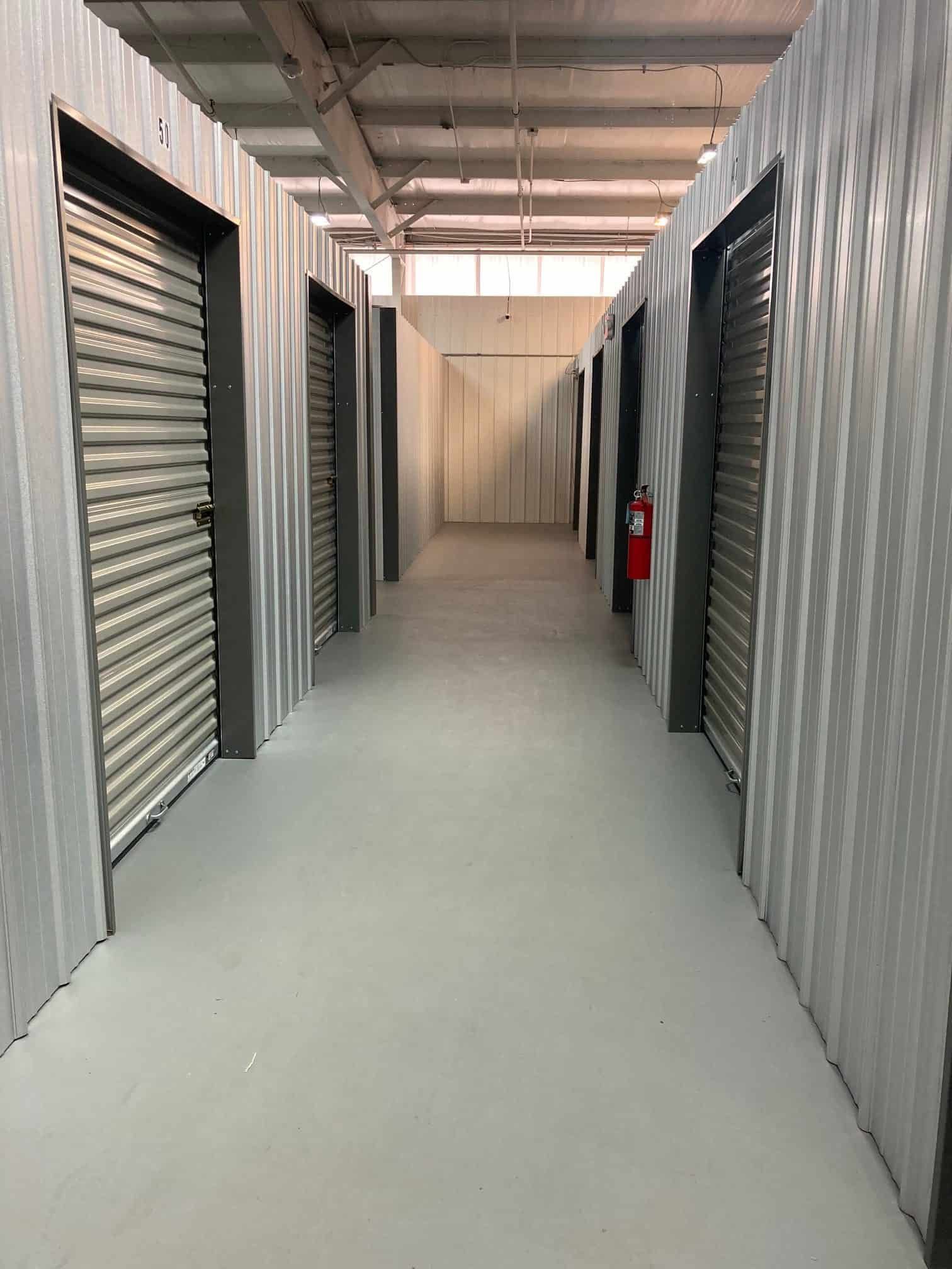 A long hallway filled with lots of storage units.