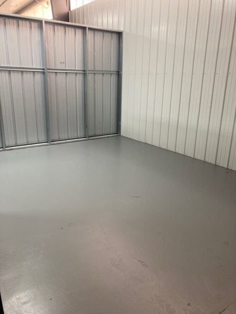 A long hallway with a lot of doors in a building