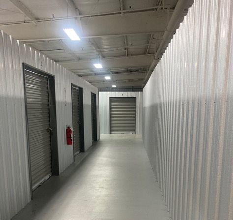 A stack of spiral notebooks sitting on top of each other on a table.