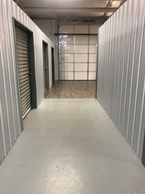 A close up of a padlock on a blue door.