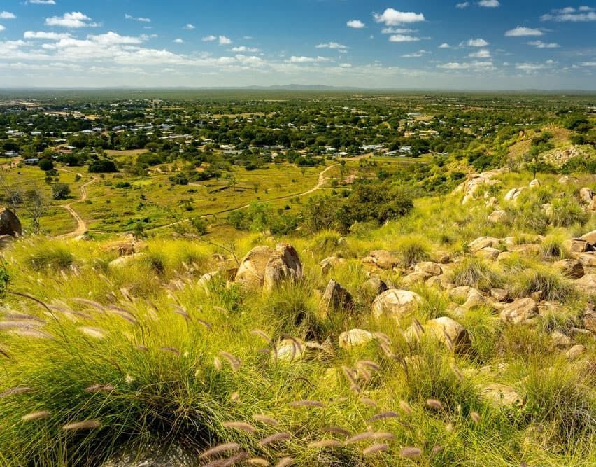 A View Of A City From The Top Of A Grassy Hill — John Stark Fencing In Landsborough, QLD