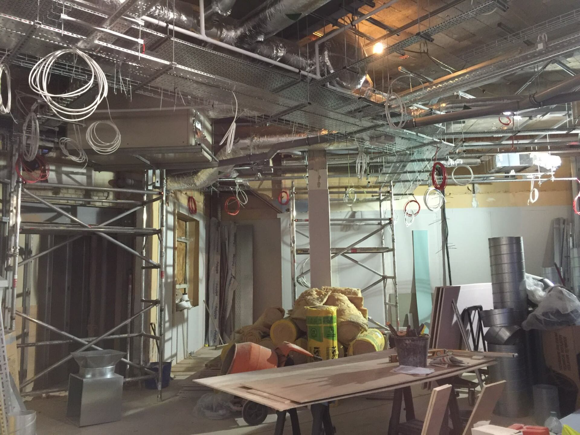 Messy wires hanging from roof of refurb property