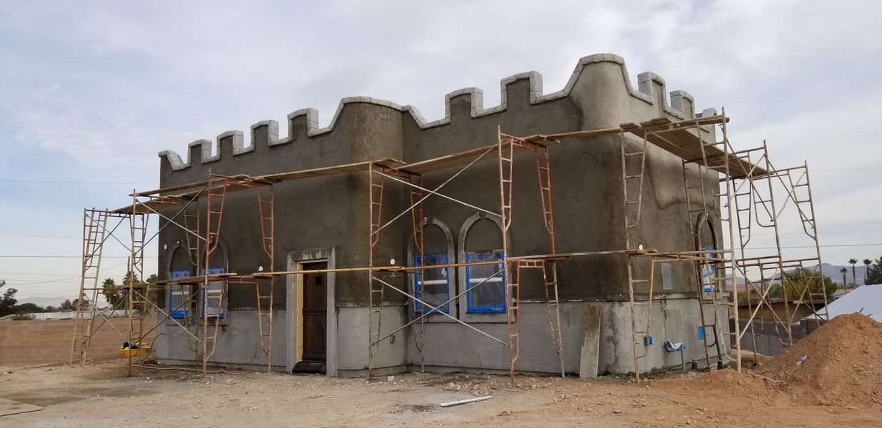 Building under construction, with scaffolding. 