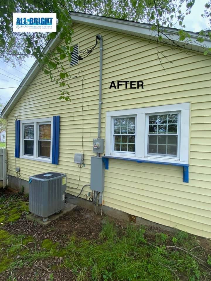 A picture of a house after being painted yellow.