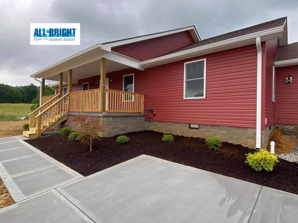 A red house with a porch and a sign that says all bright