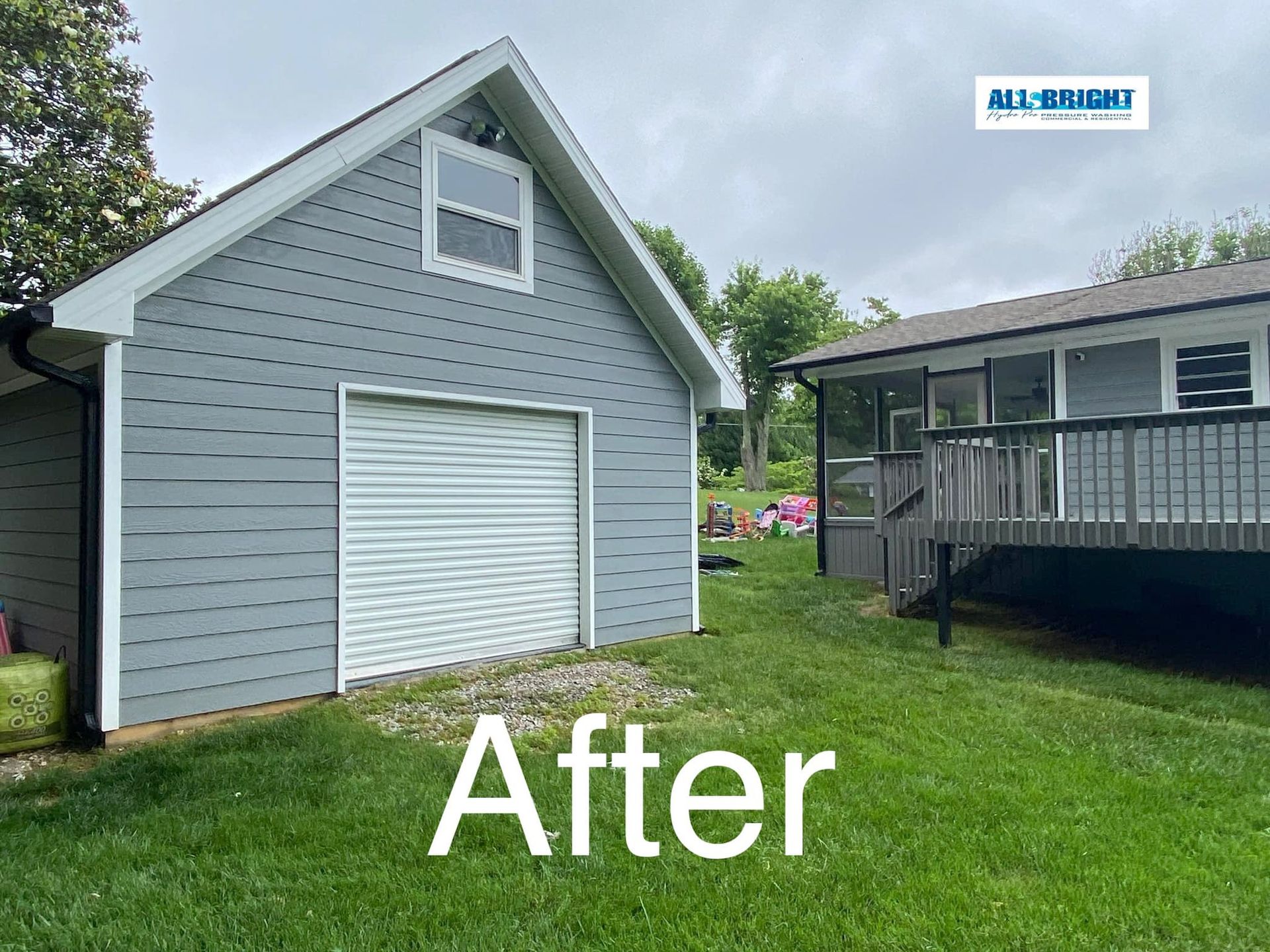 A picture of a garage and a house after being painted.