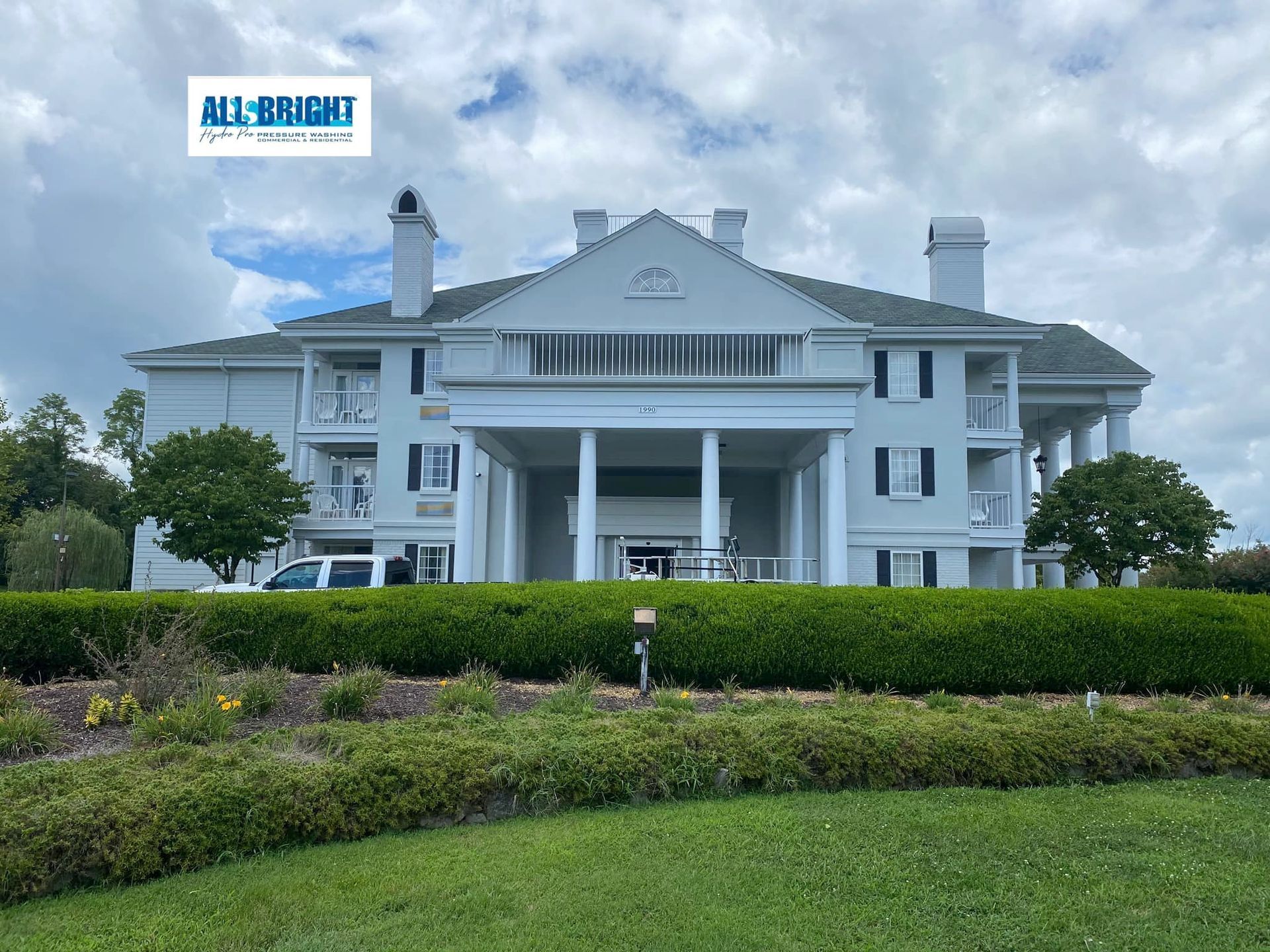 A large white building with a sign that says milbright on it