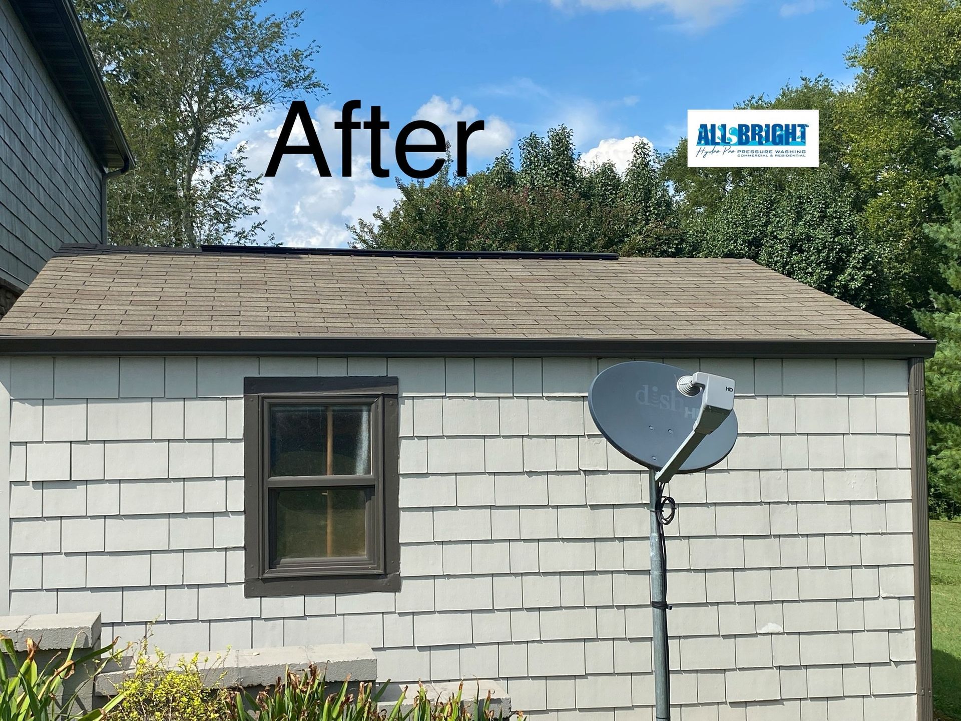 A picture of a shed with a satellite dish on it.