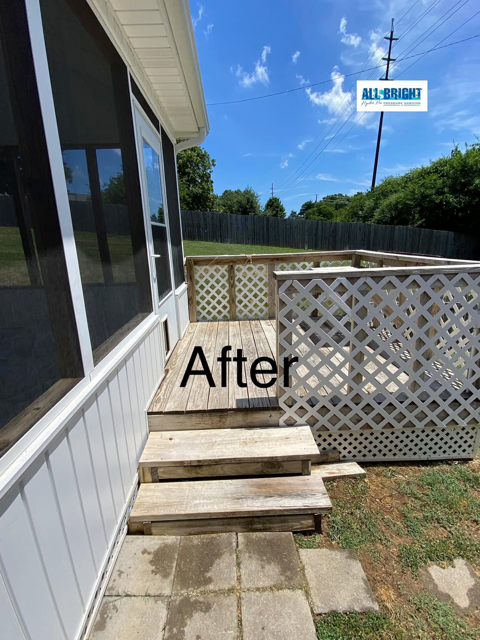 A picture of a house with a screened in porch and stairs.