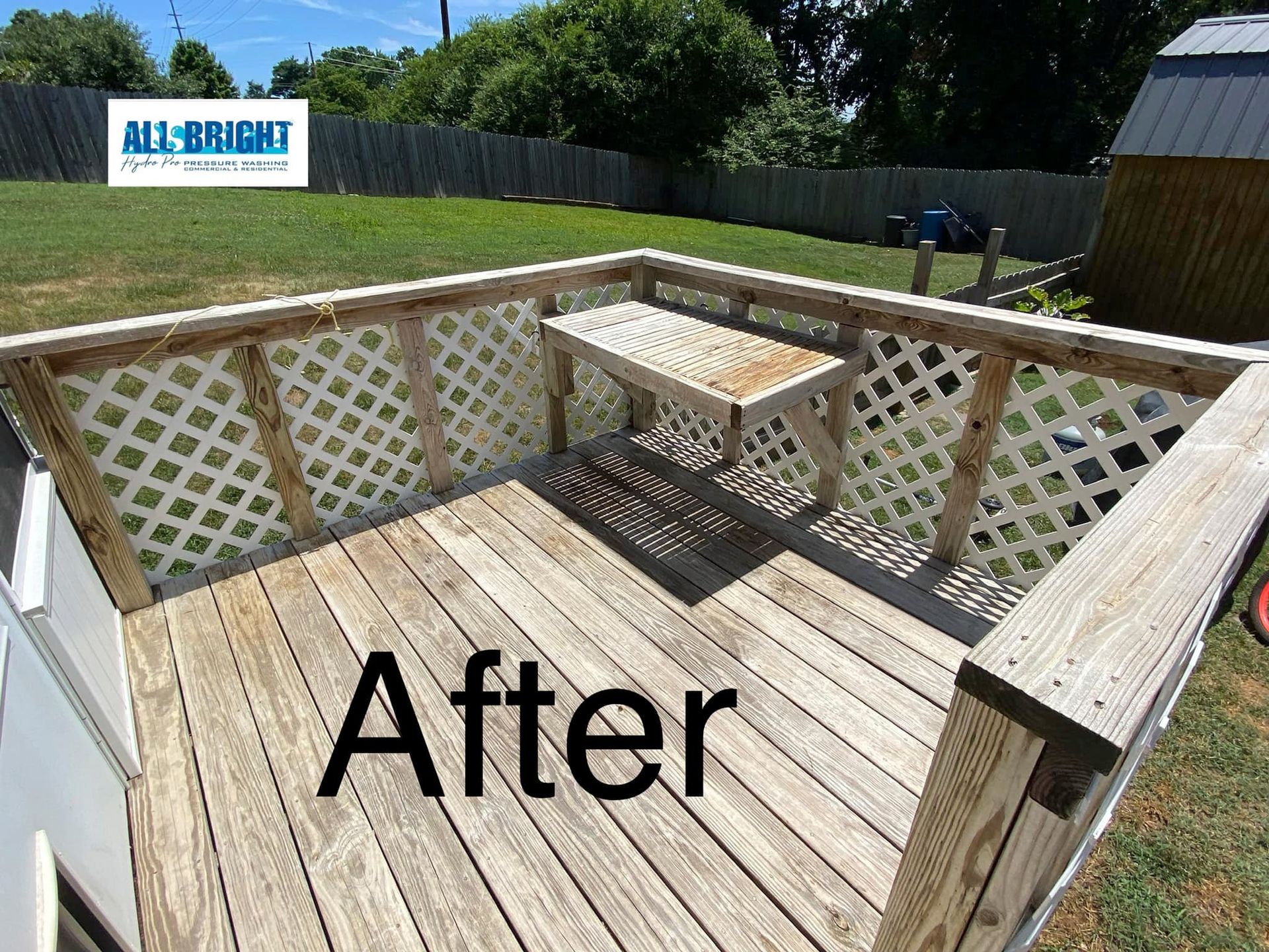 A wooden deck with a table on it and the words `` after '' written on it.