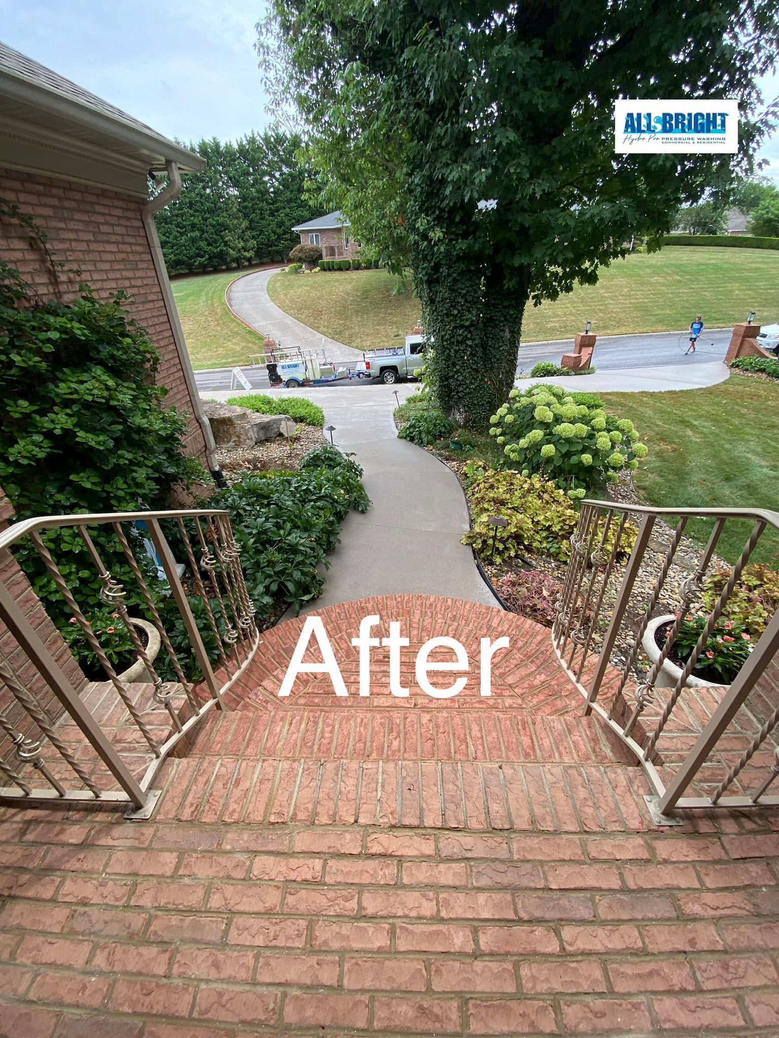 A picture of a brick walkway leading to a house.