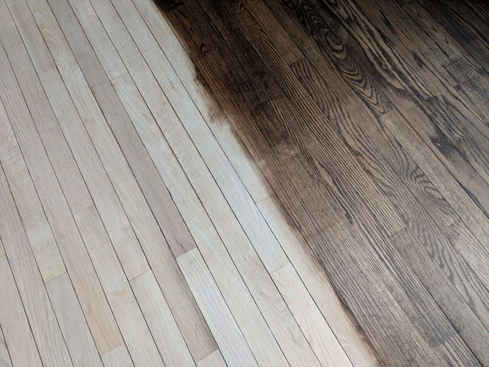 A Close Up Of A Wooden Floor That Is Being Painted — Affordable Carpets Woolgoolga In Coffs Harbour, NSW