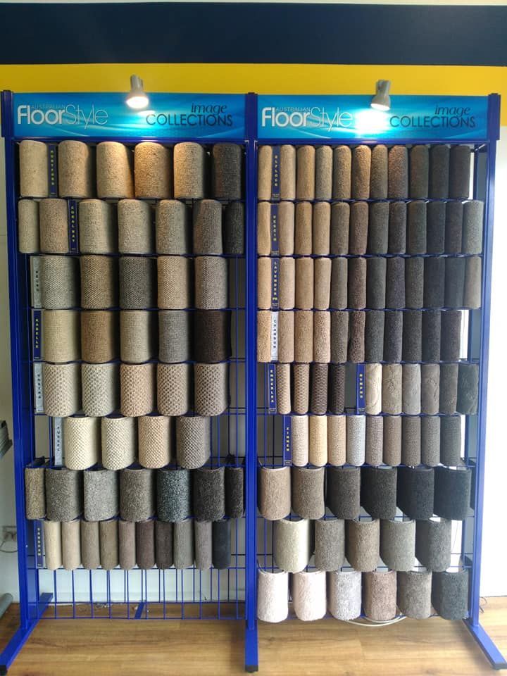A Display Of Different Colored Carpets In A Store — Affordable Carpets Woolgoolga In Woolgoolga, NSW