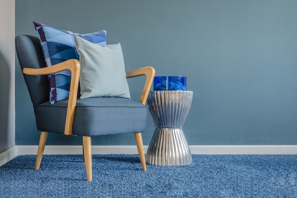 There Is A Chair And A Table In The Room — Affordable Carpets Woolgoolga In Woolgoolga, NSW